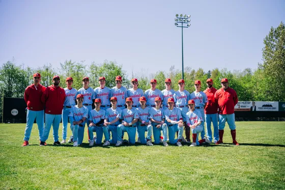 The Abbotsford Cardinals line up for a full team photo on the field.