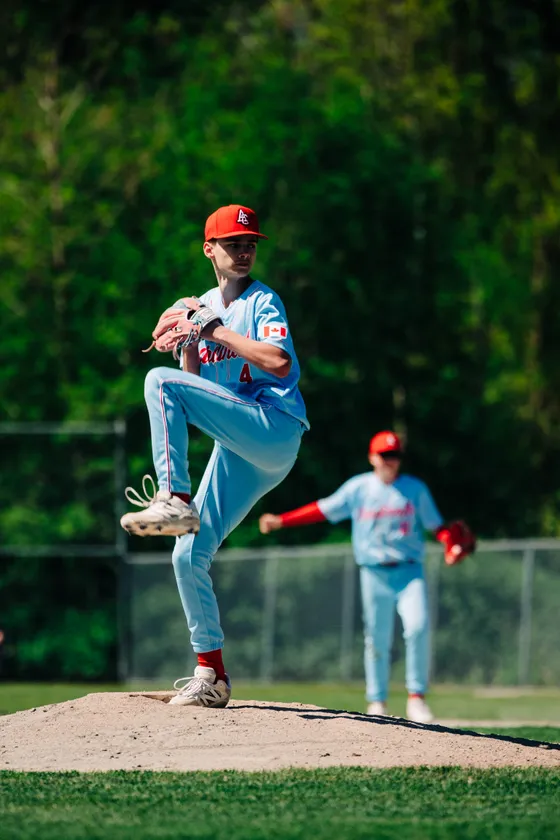 An Abbotsford Cardinals pitcher delivers during a home game.