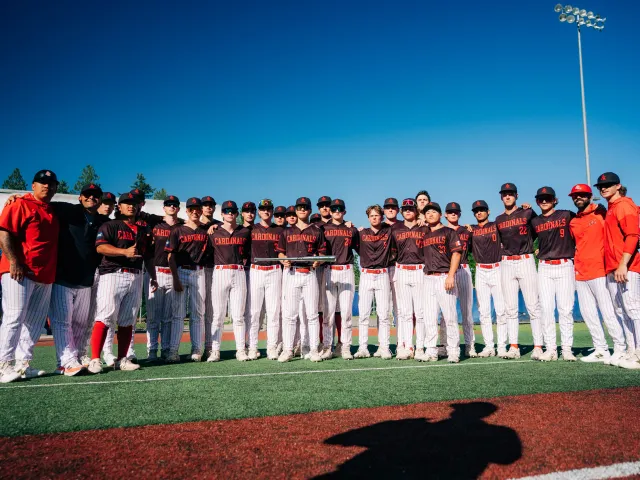 The Premier squad lined up together on the field before a game.