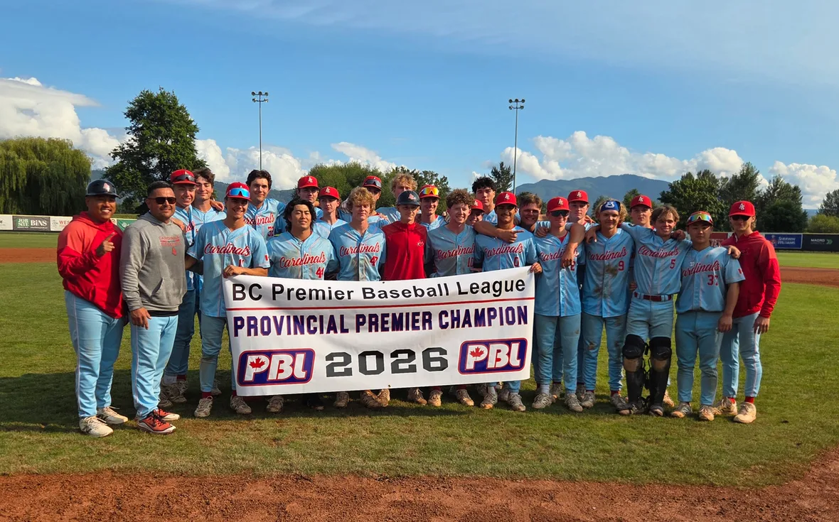 The Cardinals players and coaches gathered on the field, holding the BC Premier Baseball League's Provincial Premier Champion 2026 banner.